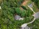 Wide aerial view of a property surrounded by lush trees, highlighting its beautiful outdoor spaces at 5308 Lambert Ct, Waxhaw, NC 28173