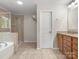 Bright bathroom with a separate tub and shower, complemented by double vanities, and lots of cabinet space at 5308 Lambert Ct, Waxhaw, NC 28173