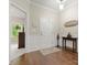 Welcoming foyer featuring hardwood floors, wainscoting, and neutral paint, creating a bright and inviting entrance at 5308 Lambert Ct, Waxhaw, NC 28173