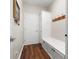 Welcoming mudroom area featuring a built-in storage bench and coat rack for added convenience and organization at 5308 Lambert Ct, Waxhaw, NC 28173