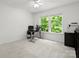 Bright office space with modern desk setup and ample natural light, ideal for productivity and comfort at 5308 Lambert Ct, Waxhaw, NC 28173