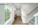 Inviting foyer with wood flooring, stairway, and natural light from large window at 581 E Sparkleberry St, Chester, SC 29706