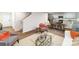 Spacious living area with open floor plan, stairs, kitchen, and wood-look flooring at 581 E Sparkleberry St, Chester, SC 29706
