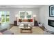 Comfortable living room includes stylish furniture, natural light, and a view to the outdoors at 581 E Sparkleberry St, Chester, SC 29706