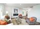 Cozy living room featuring modern fireplace, neutral furniture, and wood-look flooring at 581 E Sparkleberry St, Chester, SC 29706