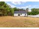 A expansive backyard with newly installed sod and white fencing awaits your personal touch at 605 Stirewalt Rd, China Grove, NC 28023