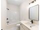 Bathroom with white vanity, modern black fixtures, and a shower-tub combination at 605 Stirewalt Rd, China Grove, NC 28023