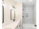 Modern bathroom featuring a glass-enclosed shower, double sinks, and sleek fixtures at 605 Stirewalt Rd, China Grove, NC 28023