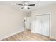 Bright bedroom with wood floors, white trim, and ceiling fan; note the double door closet at 605 Stirewalt Rd, China Grove, NC 28023