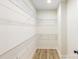 Walk-in closet with metal shelving and laminate flooring, providing ample storage space at 605 Stirewalt Rd, China Grove, NC 28023
