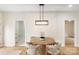 Dining area features a round table with upholstered chairs and views to other rooms at 605 Stirewalt Rd, China Grove, NC 28023