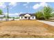 Charming single-story home features black trim, a dark roof and a driveway at 605 Stirewalt Rd, China Grove, NC 28023