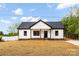 Charming single-story home boasts a newly installed roof and freshly painted white siding at 605 Stirewalt Rd, China Grove, NC 28023