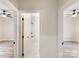 Hallway view showcasing two bedrooms with ceiling fans and the bathroom with marble tile at 605 Stirewalt Rd, China Grove, NC 28023