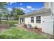 Backyard featuring a patio, lawn, tasteful landscaping, and view of the adjacent homes at 614 Stone Village Dr, Fort Mill, SC 29708