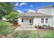 This home has a serene backyard with patio, lush grass and tasteful landscaping at 614 Stone Village Dr, Fort Mill, SC 29708