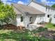 Backyard featuring a patio, lawn, tasteful landscaping, and view of the adjacent homes at 614 Stone Village Dr, Fort Mill, SC 29708