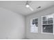 Well-lit bedroom featuring neutral walls, updated fixtures, and carpet flooring at 614 Stone Village Dr, Fort Mill, SC 29708