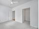 Bedroom with a ceiling fan, ensuite bathroom access, and a closet at 614 Stone Village Dr, Fort Mill, SC 29708
