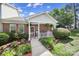 Charming brick home with a inviting front porch and well-manicured landscaping at 614 Stone Village Dr, Fort Mill, SC 29708