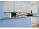 Bright kitchen area featuring white cabinets, granite countertops, and modern appliances at 614 Stone Village Dr, Fort Mill, SC 29708
