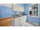 Bright kitchen featuring white cabinets, granite countertops, and ample storage space at 614 Stone Village Dr, Fort Mill, SC 29708