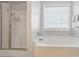 Bright bathroom with tub and shower at 6314 Bluffton Ln, Midland, NC 28107