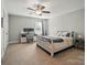 Bedroom with carpet flooring featuring a desk and a bed frame at 6314 Bluffton Ln, Midland, NC 28107