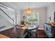 Cozy dining room featuring hardwood floors, stylish light fixture and lots of natural light at 6314 Bluffton Ln, Midland, NC 28107