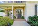 Inviting front porch featuring classic brick accents, a cozy seating area, and manicured landscaping at 6314 Bluffton Ln, Midland, NC 28107