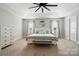Inviting primary bedroom with tray ceiling, neutral tones, and carpet flooring at 6314 Bluffton Ln, Midland, NC 28107