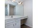 Bright bathroom with white vanity and large mirror, offering ample counter space at 6717 Ware Rd, Charlotte, NC 28212