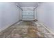 Empty garage with a concrete floor and white walls and ceiling at 6717 Ware Rd, Charlotte, NC 28212