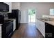 Modern kitchen with granite countertops and stainless steel appliances at 6717 Ware Rd, Charlotte, NC 28212
