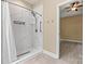 Modern bathroom featuring a spacious walk-in shower with marble-style tile and updated fixtures at 7020 Cedar Ridge Ct, Mount Holly, NC 28120