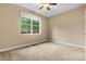 Inviting bedroom with a large window and neutral carpet offering lots of natural light at 7020 Cedar Ridge Ct, Mount Holly, NC 28120