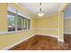 Bright dining room with natural light, hardwood floors, and neutral color at 7020 Cedar Ridge Ct, Mount Holly, NC 28120