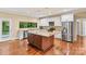 Gourmet kitchen with granite countertops and stainless steel appliances at 7020 Cedar Ridge Ct, Mount Holly, NC 28120