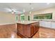 Spacious kitchen island with granite countertop, accompanied by recessed lighting at 7020 Cedar Ridge Ct, Mount Holly, NC 28120