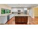 Bright kitchen features stainless steel appliances, granite countertops, and a large center island at 7020 Cedar Ridge Ct, Mount Holly, NC 28120