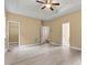 Large main bedroom with tray ceiling, neutral color and laminate flooring at 7020 Cedar Ridge Ct, Mount Holly, NC 28120
