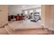 Large bonus room with plush carpeting and exercise equipment with a desk and chair for home office potential at 7245 Willow Brook Ct, Denver, NC 28037