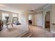 Spacious bonus room with carpeting, multiple windows, exercise equipment and adjacent bedroom at 7245 Willow Brook Ct, Denver, NC 28037