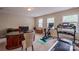 Bonus room featuring carpeting, exercise equipment, and natural light with large desk at 7245 Willow Brook Ct, Denver, NC 28037