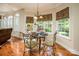 Cozy breakfast nook with a glass table and backyard view, perfect for relaxed dining at 7245 Willow Brook Ct, Denver, NC 28037