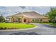 Well-maintained clubhouse featuring brick facade, covered entrance, and landscaped grounds at 7245 Willow Brook Ct, Denver, NC 28037