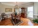 Charming dining room with hardwood floors, chandelier, and wooden table and chairs at 7245 Willow Brook Ct, Denver, NC 28037