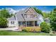 Charming two-story brick home with well-maintained landscaping and inviting front porch at 7245 Willow Brook Ct, Denver, NC 28037