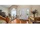 Inviting foyer with hardwood floors, a front door with sidelights, and elegant furnishings at 7245 Willow Brook Ct, Denver, NC 28037