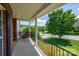 Charming covered front porch with comfortable seating and a view of the neighborhood at 7245 Willow Brook Ct, Denver, NC 28037